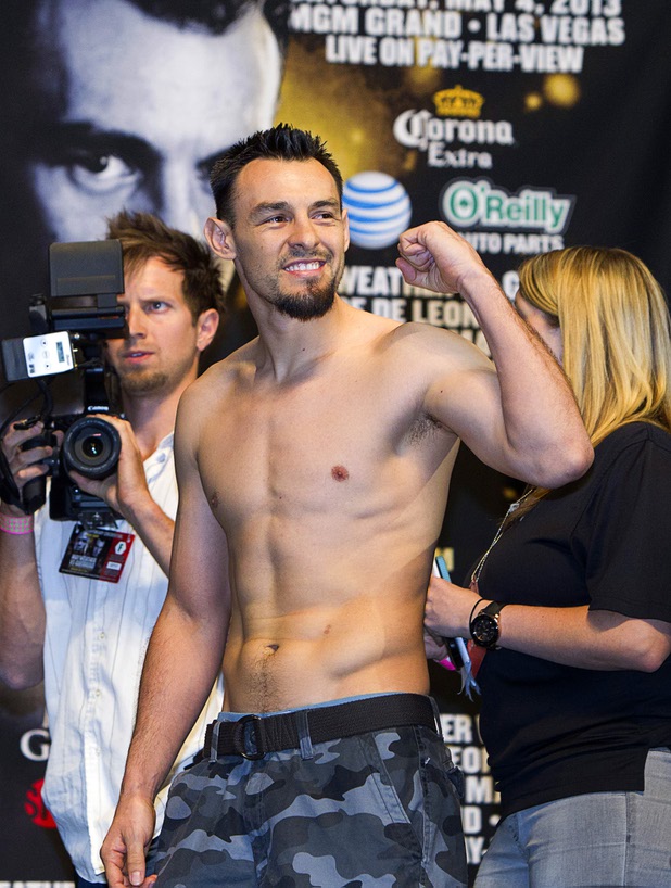 Welterweight boxer Robert Guerrero makes a fist during an official weigh-in at the MGM Grand Garden Arena Friday, May 3, 2013. Guerrero will challenge undefeated WBC welterweight champion Floyd Mayweather Jr. for the title at the arena on Saturday.