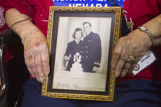 World War II Navy nurse Edna Filson, 93, of Boulder City, holds her 1945 wedding photo as World War II veterans are welcomed back after the first Las Vegas Honor Flight at McCarran International Airport Sunday, May 5, 2013. Her husband Calvin, also a Navy veteran, died last year after 67 years of marriage. About 35 Southern Nevada veterans visited Baltimore and memorials in Washington D.C.