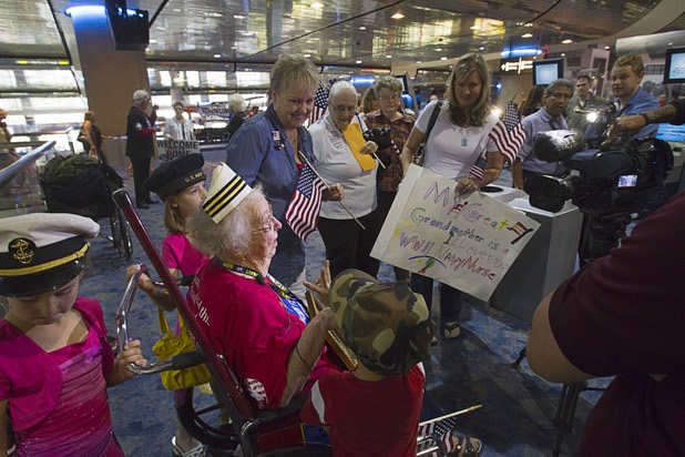World War II Navy nurse Edna Filson, 93, of Boulder City, is interviewed with family members as World War II veterans are welcomed back after the first Las Vegas Honor Flight at McCarran International Airport Sunday, May 5, 2013. About 35 Southern Nevada veterans visited Baltimore and memorials in Washington D.C.