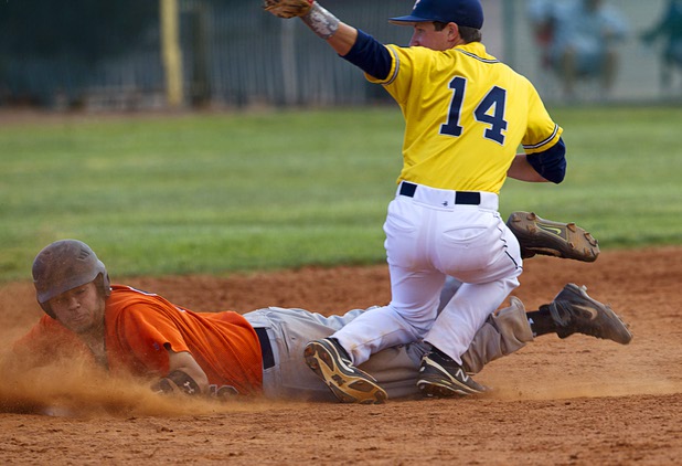 Chaparral's Brian Moya is tagged out at second base by Garrett Calloway during a playoff game against the Boulder City Eagles in Boulder City Tuesday, May 7, 2013.