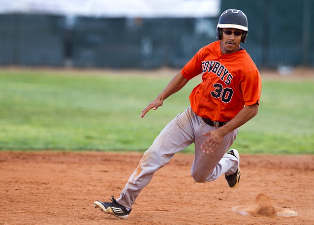 Chaparral'S Freddie Briones heads for third base during a playoff game against the Boulder City Eagles in Boulder City Tuesday, May 7, 2013.