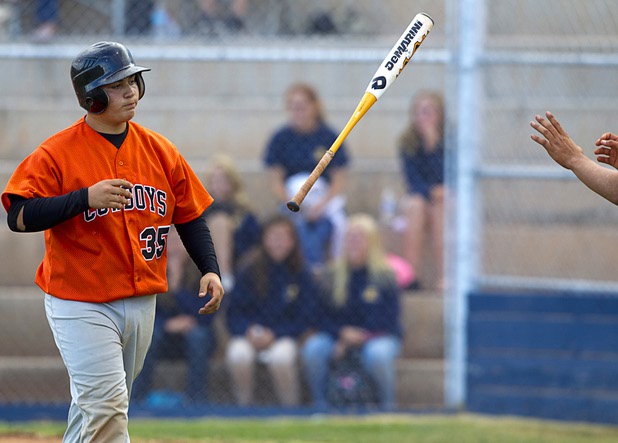 Chaparral's Eduardo Jimenez tosses a bat to the next batter after striking out during a playoff game against the Boulder City Eagles in Boulder City Tuesday, May 7, 2013.