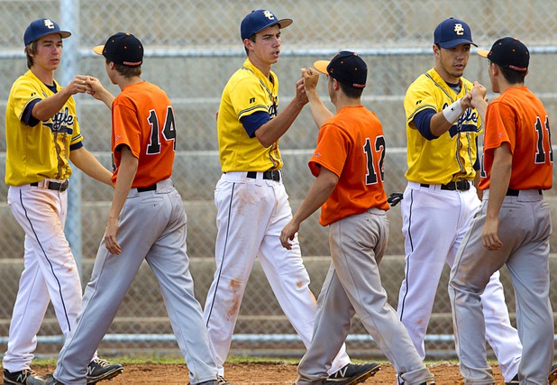 Players bump fists after a playoff game against the Boulder City Eagles in Boulder City Tuesday, May 7, 2013. The Eagles beat the Cowboys 12-5.