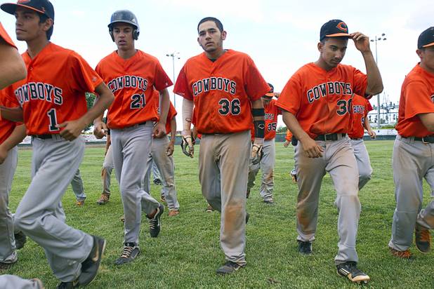 Chaparral Cowboys head back to the dugout after losing  a playoff game against the Boulder City Eagles in Boulder City Tuesday, May 7, 2013.