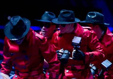 Costumed paparazzi appear to be looking for celebrities in the audience during a sneak preview of “Michael Jackson One” at Mandalay Bay on Tuesday, May 7, 2013. The new show, by Cirque du Soleil and The Estate of Michael Jackson, is scheduled to hold an official premiere June 29.