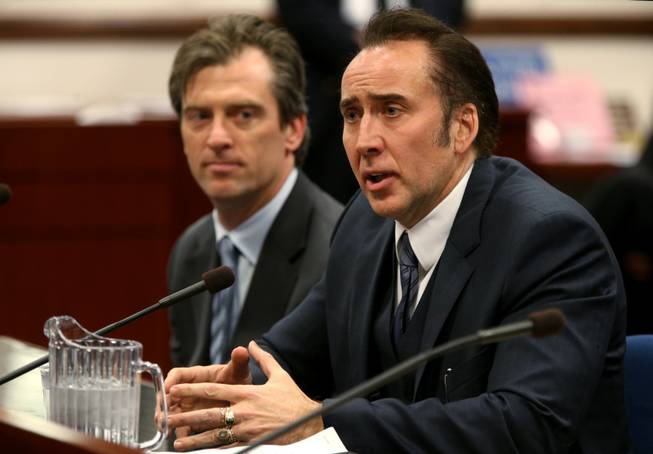 Actor Nicholas Cage testified in support of a bill proposing tax incentives to filmmakers at the Legislative Building Carson City, Nev., on Tuesday, May 7, 2013. Proponents of the measure say it will bring jobs and revenue to the state. Cage's agent Michael Nilon is at left. 