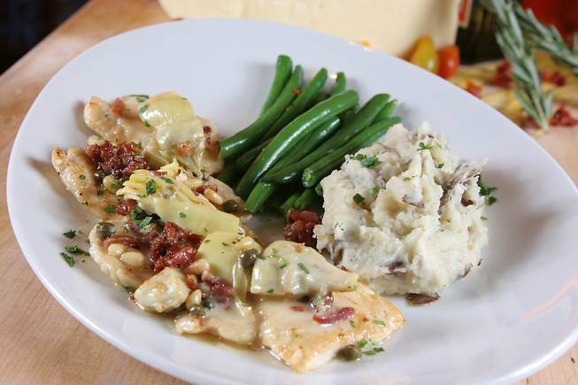 Chicken scaloppine sautéed with artichoke hearts, pancetta, capers, pine nuts and lemon butter sauce with green beans and garlic mashed potatoes served for Mother's Day at Trevi inside the Forum Shops at Caesars Palace.