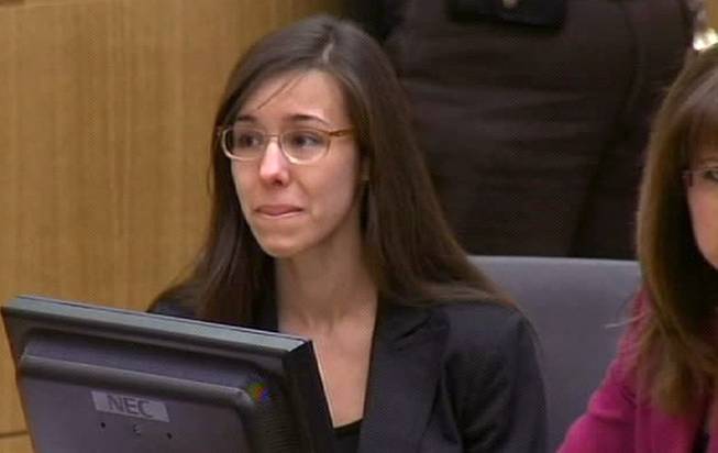 In this image made from pool video provided by APTN, Jodi Arias reacts during the reading of the verdict at Maricopa County Superior Court in Phoenix, Wednesday, May 8, 2013. Arias was convicted of first-degree murder in the gruesome killing of her one-time boyfriend in Arizona.