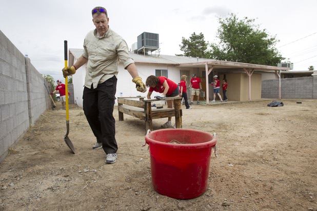 as Keller Williams associates from the Market Place Offices work on a home near Boulder Highway and Sahara Avenue Thursday, May 9, 2013. The associates were among more than 70,000 workers around the world participating in the fifth annual Keller Williams RED Day. RED Day (Renew, Energize and Donate) is an initiative where Keller Williams associates donate a day to give back to the community.
