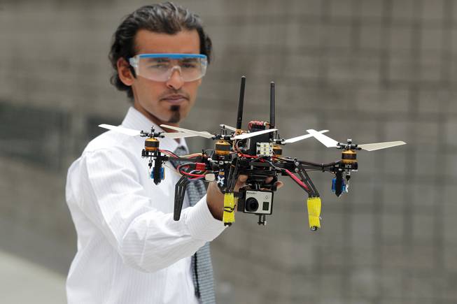 Senior mechanical engineering student Muhammad Ayub demonstrates the Variable Pitch Quad Rotor Kopter during the UNLV College of Engineering Senior Design Competition on Thursday, May 9, 2013 at the Cox Pavilion in Las Vegas.
