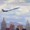 In this Thursday, May 9, 2013, photo, an Allegiant Air jetliner flies over the the the New York-New York Hotel & Casino after taking off from McCarran International Airport in Las Vegas.