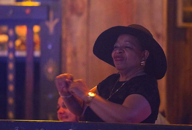 A woman dances by her table during a Mother's Day “Kirk Franklin’s Gospel Brunch” at the House of Blues in Mandalay Bay Sunday, May 12, 2013.