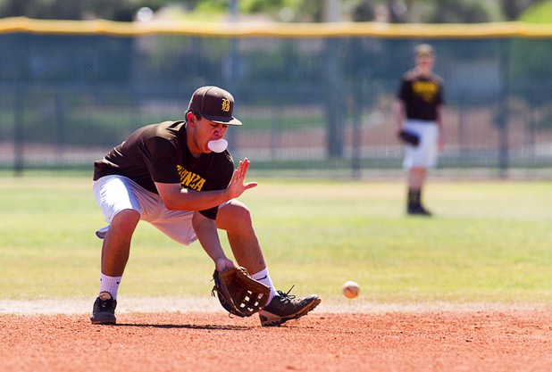 Sean DeSoto fields a ball while chewing bubble gum during practice at Bonanza High School Monday, May 13, 2013. Bonanza is the surprise team in the state tournament, upsetting the seven-time state champion Bishop Gorman High School twice in last week's double elimination Sunset Regional event.