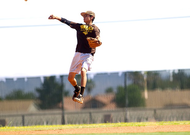 Shortstop Cruz Nevarez makes a throw during practice at Bonanza High School Monday, May 13, 2013. Bonanza is the surprise team in the state tournament, upsetting the seven-time state champion Bishop Gorman High School twice in last week's double elimination Sunset Regional event.