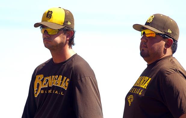 Coach Derek Stafford, left, and assistant coach Matt Estrada watch players practice at Bonanza High School Monday, May 13, 2013. Bonanza is the surprise team in the state tournament, upsetting the seven-time state champion Bishop Gorman High School twice in last week's double elimination Sunset Regional event.