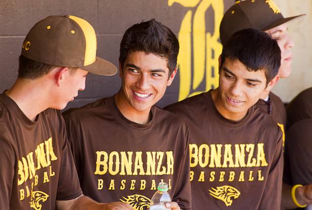 Pitcher David Estrada, left, third baseman Alec Taft, center, and shortstop Cruz Nevarez talk in the dugout during practice at Bonanza High School Monday, May 13, 2013. Bonanza is the surprise team in the state tournament, upsetting the seven-time state champion Bishop Gorman High School twice in last week's double elimination Sunset Regional event.