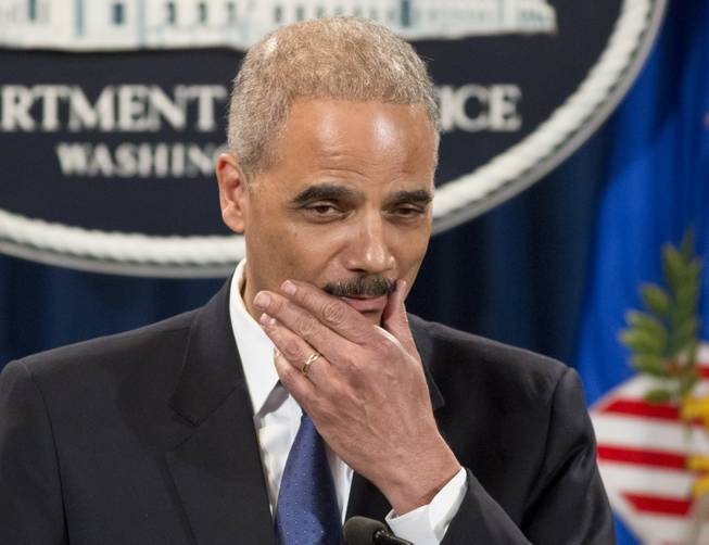 Attorney General Eric Holder pauses during a news conference at the Justice Department in Washington, Tuesday, May 14, 2013. Holder said he's ordered a Justice Department investigation into the Internal Revenue Service's targeting of conservative groups for extra tax scrutiny.