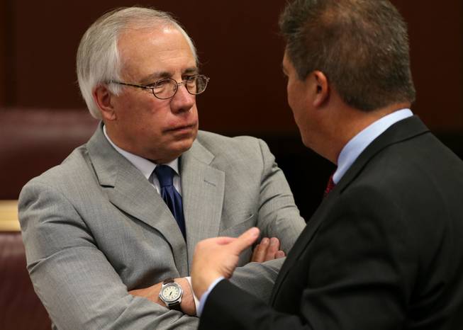 Nevada Assembly Minority Leader Pat Hickey, R-Reno, left, talks with lobbyist Rocky Finseth at the Legislative Building Carson City on Tuesday, May 7, 2013. 