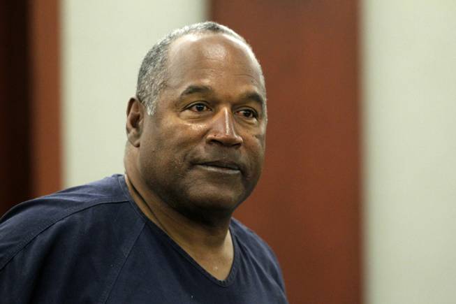 O. J. Simpson stands during a break during the second day of evidentiary hearing in Clark County District Court on May 14, 2013 in Las Vegas, Nevada. Simpson, who is currently serving a nine-to-33-year sentence in state prison as a result of his October 2008 conviction for armed robbery and kidnapping charges, is using a writ of habeas corpus to seek a new trial, claiming he had such bad representation that his conviction should be reversed. Steve Marcus/pool