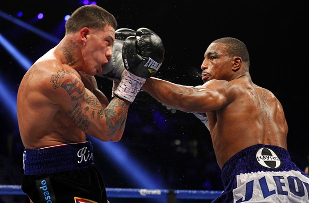 Undefeated middleweight boxer J'Leon Love, right, lands a punch on Gabriel Rosado during their fight at the MGM Grand Garden Arena Saturday, May 4, 2013.  Love, a menber of Floyd Mayweather Jr.'s "Money Team," tested positive for the banned diuretic, Hydrochlorothiazide in his post-fight Nevada State Athletic Commission drug test, according to reports. 