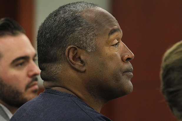 O.J. Simpson listens to testimony at an evidentiary hearing in Clark County District Court Thursday, May 16, 2013. Simpson, who is currently serving a nine-to-33-year sentence in state prison as a result of his October 2008 conviction for armed robbery and kidnapping charges, is using a writ of habeas corpus to seek a new trial, claiming he had such bad representation that his conviction should be reversed.