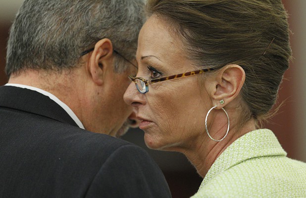 O.J. Simpson attorneys Ozzie Fumo (L) and Patricia Palm confer during Simpson's evidentiary hearing in Clark County District Court Thursday, May 16, 2013. Simpson, who is currently serving a nine-to-33-year sentence in state prison as a result of his October 2008 conviction for armed robbery and kidnapping charges, is using a writ of habeas corpus to seek a new trial, claiming he had such bad representation that his conviction should be reversed.