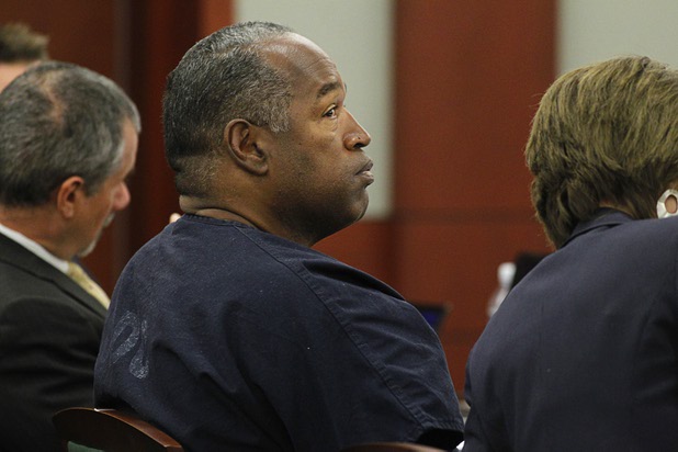 O.J. Simpson (C) waits for the start of the fifth day of an evidentiary hearing in Clark County District Court Friday, May 17, 2013.. Simpson, who is currently serving a nine-to-33-year sentence in state prison as a result of his October 2008 conviction for armed robbery and kidnapping charges, is using a writ of habeas corpus to seek a new trial, claiming he had such bad representation that his conviction should be reversed.