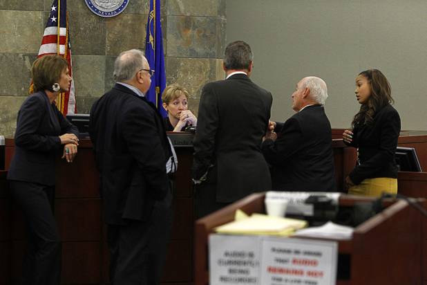 Judge Linda Marie Bell speaks with attorneys during a break in O.J. Simpson's evidentiary hearing in Clark County District Court Friday, May 17, 2013.. Attorneys (L-R) are: Patricia Palm, Tom Pitaro, Ozzie Fumo, H. Leon Simon, chief deputy Clark County district attorney, and Leah Beverly, deputy Clark County district attorney. Simpson, who is currently serving a nine-to-33-year sentence in state prison as a result of his October 2008 conviction for armed robbery and kidnapping charges, is using a writ of habeas corpus to seek a new trial, claiming he had such bad representation that his conviction should be reversed.
