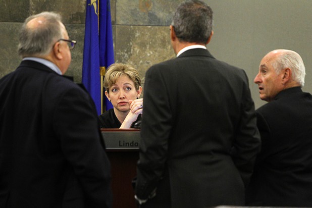 Judge Linda Marie Bell listens to attorneys during a break in O.J. Simpson's evidentiary hearing in Clark County District Court Friday, May 17, 2013.. Attorneys (L-R) are: Tom Pitaro, Ozzie Fumo and H. Leon Simon, chief deputy Clark County district attorney. Simpson, who is currently serving a nine-to-33-year sentence in state prison as a result of his October 2008 conviction for armed robbery and kidnapping charges, is using a writ of habeas corpus to seek a new trial, claiming he had such bad representation that his conviction should be reversed.