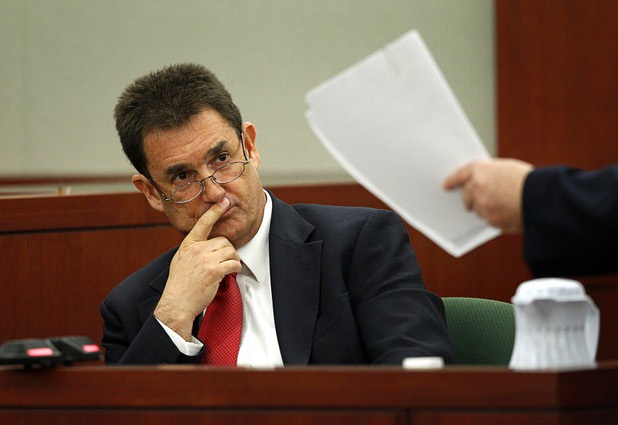 Yale Galanter, O.J. Simpson's former defense attorney, looks at a document held by Simpson lawyer Tom Pitaro during an evidentiary hearing in Clark County District Court Friday, May 17, 2013.. Simpson, who is currently serving a nine-to-33-year sentence in state prison as a result of his October 2008 conviction for armed robbery and kidnapping charges, is using a writ of habeas corpus to seek a new trial, claiming he had such bad representation that his conviction should be reversed.