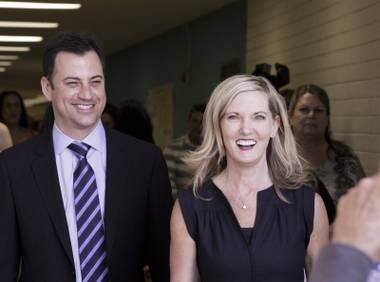 Jimmy Kimmel of ABC’s “Jimmy Kimmel Live” and Clark High School Principal Jill Pendleton head toward a ceremony area before a ribbon cutting at Clark High School to officially open the Jimmy Kimmel Technology Center on Saturday, May 18, 2013.