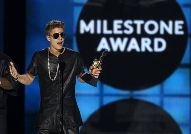 Justin Bieber accepts the Milestone Award during the 2013 Billboard Music Awards at MGM Grand Garden Arena on Sunday, May 19, 2013.