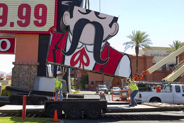 The head of the Terribles Cowboy signage is lowered to a flatbed trailer at Terribles Hotel & Casino, 4100 Paradise Rd., Monday, May 20, 2013. The property is being renamed Silver Sevens Hotel & Casino. The new name and signage is part of a $5 million renovation project by Affinity Gaming. The cowboy sign is being donated to the Neon Museum.