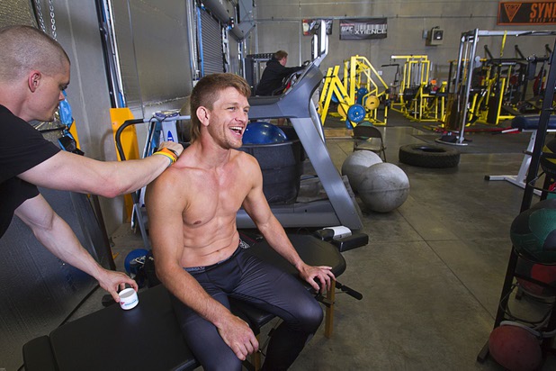 Jacob Steckel, left, a certified chiropractic sports physician, works on UFC welterweight fighter Mike Pyle before a workout at the Syndicate gym Monday, May 20, 2013. Pyle will fight Rick Story at the MGM Grand Garden Arena Saturday.