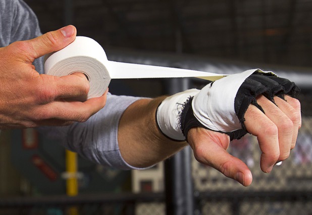 UFC welterweight fighter Mike Pyle wraps his gloves before a workout at the Syndicate gym Monday, May 20, 2013. Pyle will fight Rick Story at the MGM Grand Garden Arena Saturday.