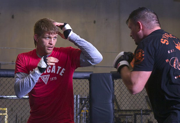 UFC welterweight fighter Mike Pyle, left, spars with Nate Pettit as he prepares for UFC 160 at the Syndicate gym Monday, May 20, 2013. Pyle will fight Rick Story at the MGM Grand Garden Arena Saturday.
