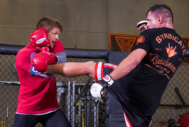 UFC welterweight fighter Mike Pyle, left, blocks a kick from Nate Pettit as he prepares for UFC 160 at the Syndicate gym Monday, May 20, 2013. Pyle will fight Rick Story at the MGM Grand Garden Arena Saturday.