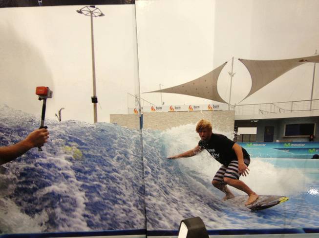 American Wave Machines sells stationary machines that let people surf and body board in place. The company's booth at RECon, the retail industry trade show at the Las Vegas Convention Center, has a picture of a surfer using the machine. The picture was split on two display boards. The machines can be built in a range of sizes and typically cost between $300,000 and $5 million.