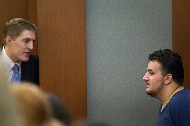 Alleged pimp Arman Izadi, right, speaks with defense attorney Dylan Ciciliano in District Court at the Regional Justice Center Tuesday, May 21, 2013.