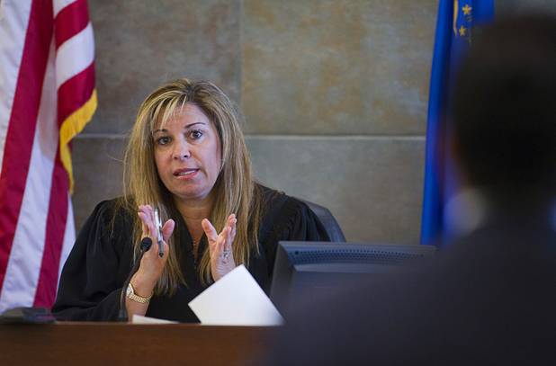 Judge Abbi Silver speaks to Michael Cristalli, defense attorney for alleged pimp Arman Izadi, in District Court at the Regional Justice Center Tuesday, May 21, 2013.