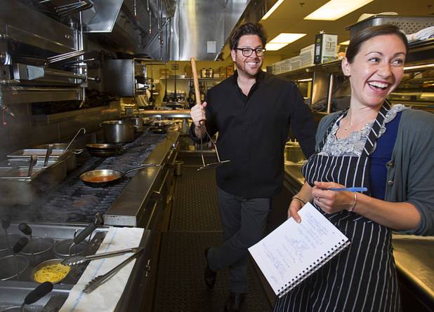 Chef Scott Conant shows Las Vegas Weekly's Sarah Feldberg his tomato masher as they make spaghetti in the Scarpetta restaurant kitchen at the Cosmopolitan Wednesday, May 22, 2013.