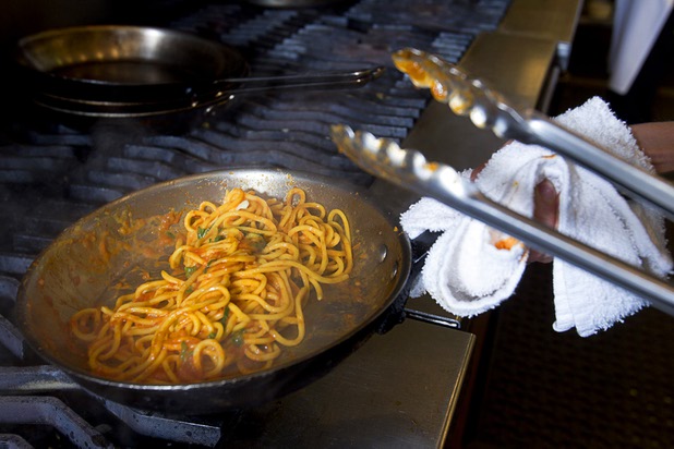 Las Vegas Weekly's Sarah Feldberg makes spaghetti in the Scarpetta restaurant kitchen at the Cosmopolitan Wednesday, May 22, 2013.