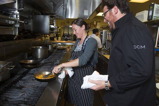 Las Vegas Weekly's Sarah Feldberg and chef Scott Conant make spaghetti in the Scarpetta restaurant kitchen at the Cosmopolitan Wednesday, May 22, 2013.