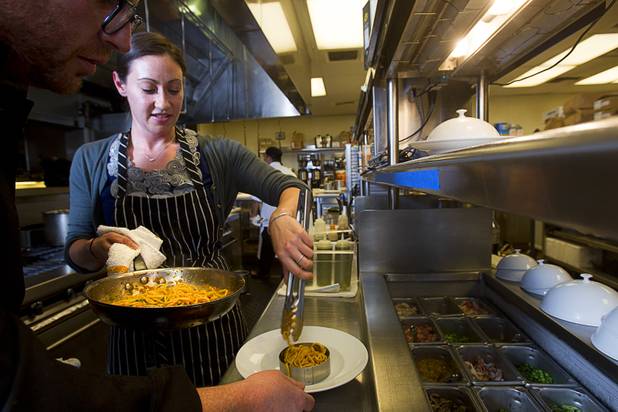 Chef Scott Conant and Las Vegas Weekly's Sarah Feldberg make spaghetti in the Scarpetta restaurant kitchen at the Cosmopolitan Wednesday, May 22, 2013.