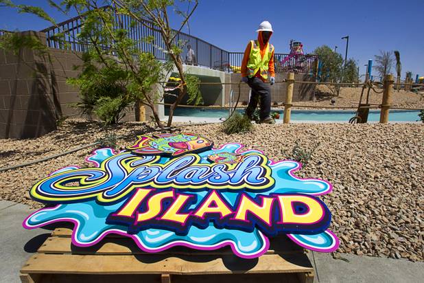 A landscaper works near Splash Island at the Wet 'n' Wild Las Vegas water park, 7055 S. Fort Apache Road, Wednesday, May 22, 2013. The new 41-acre park opens to Gold Pass holders on Saturday. Single day tickets are available from June 3.