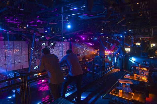 People watch a light and video show at the Light nightclub at Mandalay Bay Thursday, May 23, 2013. The new 38,000 sq. ft. club is a collaboration by Cirque du Soleil and The Light Group.