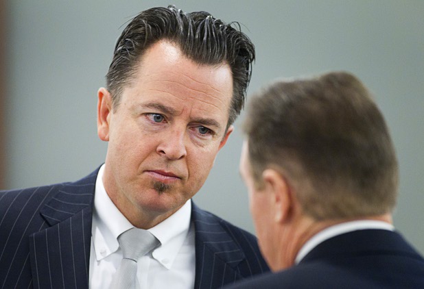 Defense attorneys Jeff Banks, left and David Schieck, confer during a hearing for Jacob Dismont, 18, and Michael Solid, 21, in Las Vegas Justice Court at the Regional Justice Center Thursday, May 23, 2013. Solid and Dismont are accused of killing 15-year-old Marcos Arenas while stealing his iPad.