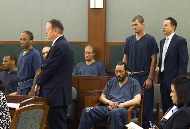 Michael Solid, left, 21, and Jacob Dismont, 18, stand with defense attorneys in Las Vegas Justice Court at the Regional Justice Center Thursday, May 23, 2013. Solid and Dismont are accused of killing 15-year-old Marcos Arenas while stealing his iPad. Attorneys are David Schieck, left, and Jeff Banks.