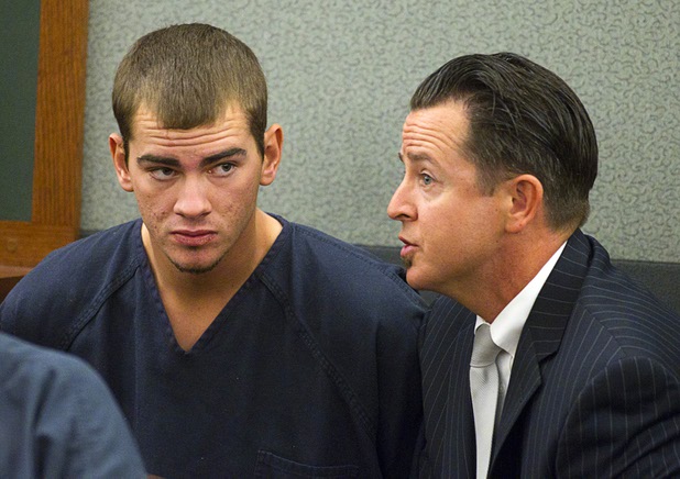 Jacob Dismont, 18, listens to defense attorney Jeff Banks in Las Vegas Justice Court at the Regional Justice Center Thursday, May 23, 2013. Dismont and Michael Solid, 21, are accused of killing 15-year-old Marcos Arenas while stealing his iPad.
