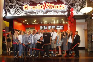 Television and movie personality Jason “Wee Man” Acuna helps cut the ribbon during the grand opening of Chronic Tacos at the Palms Friday, May 31, 2013.